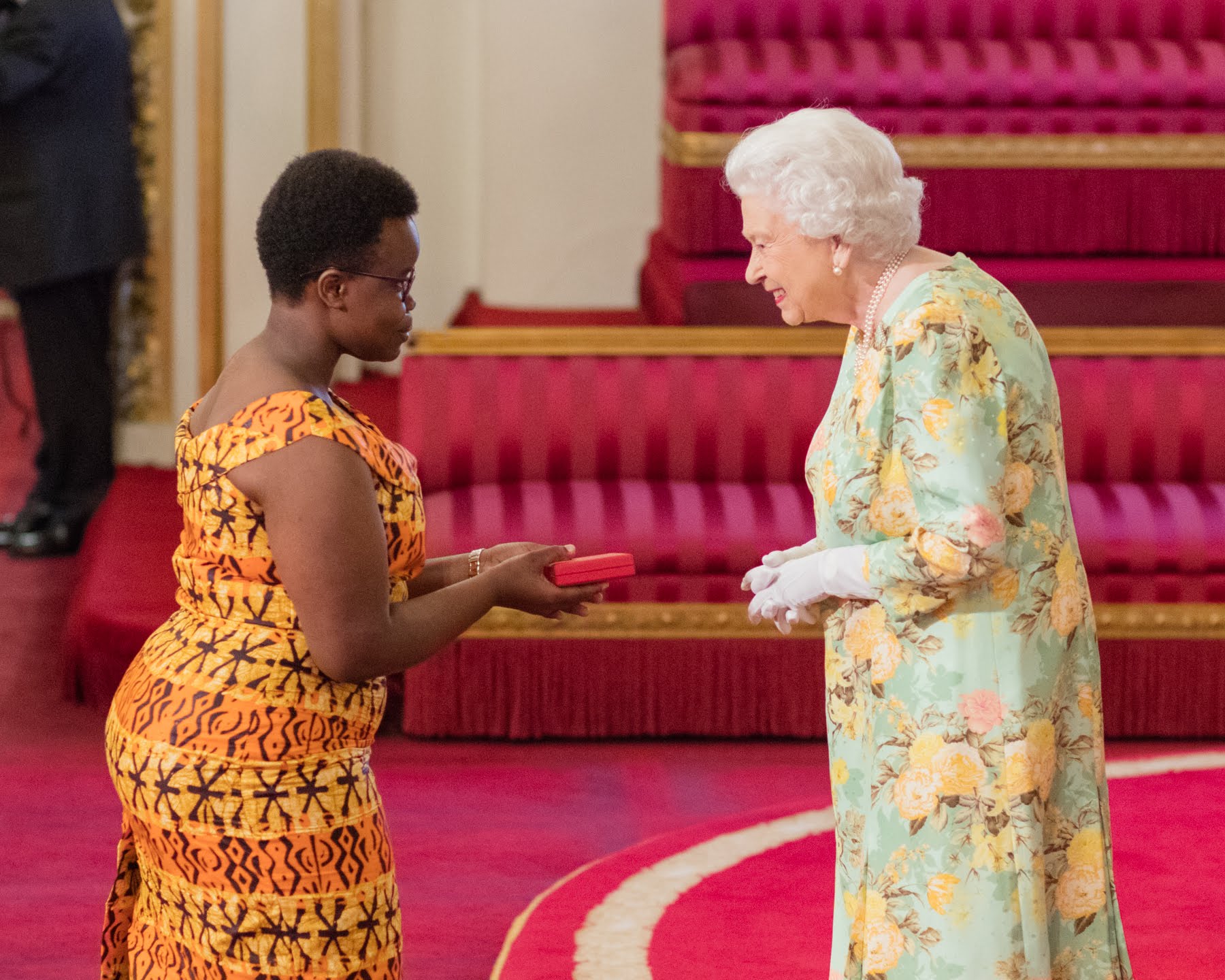 Alice Ahadi Magaka with The Queen