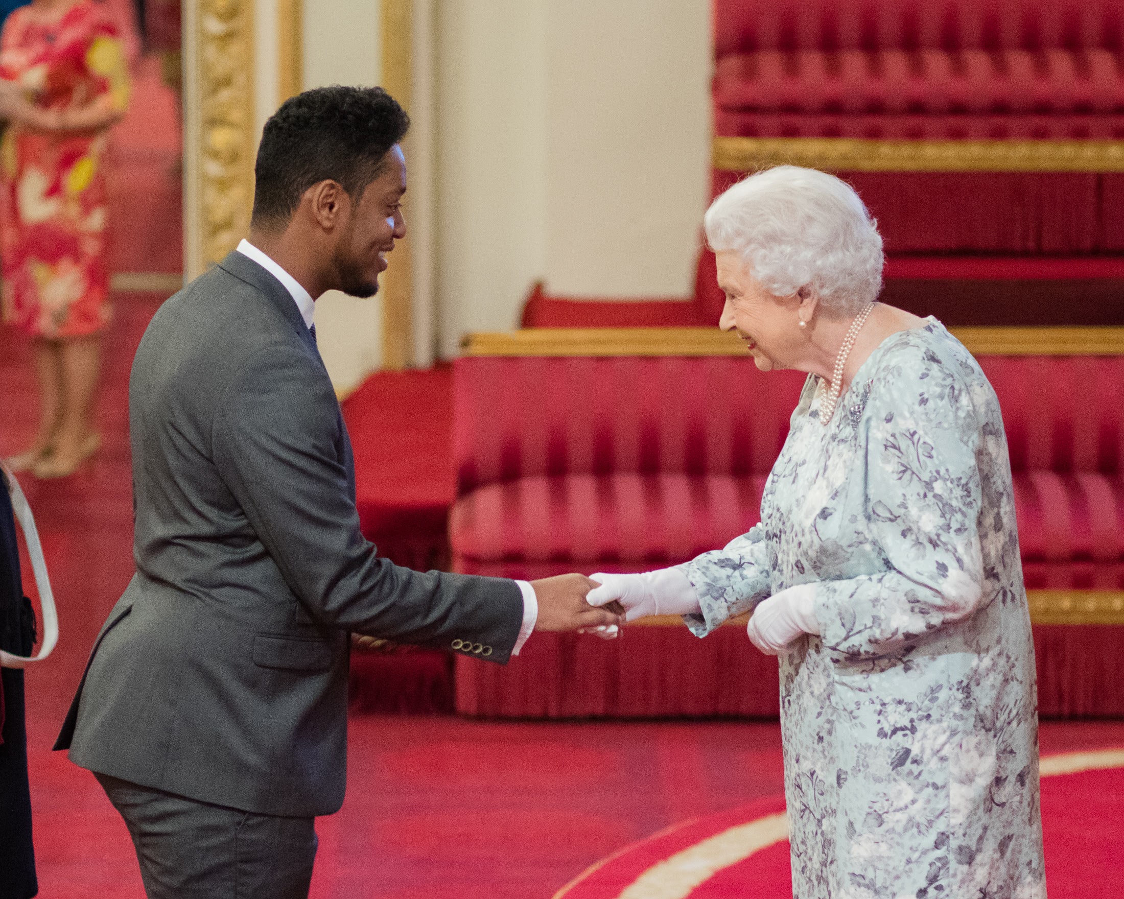 Abdullahi ALim receiving his Queen's Young Leaders Award from Her Majesty The Queen